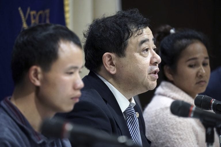 In this Nov. 28, 2018, photo, lawyer Shoichi Ibusuki, (center), attends a press conference on the problems in Japan's technical intern program, with Eng Pisey, (right), Cambodian technical intern and Huang Shihu, left, Chinese technical intern in Tokyo. Ibusuki, lawyer specializing in labor cases and supporting victimized foreign students and interns, called the internship program as a disguise to use trainees as mere cheap labor and should be scrapped and replaced with the new program underway. Japan is set to approve legislation that would officially open the door to foreign workers to do unskilled jobs and possibly eventually become citizens. (Eugene Hoshiko/AP Photo)