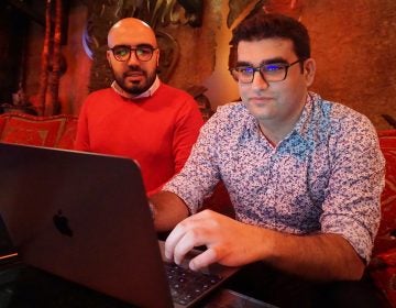 Certfa researchers Nariman Gharib, (left), and Amin Sabeti look at a computer at a cafe in London on Friday, Dec. 7, 2018. The Associated Press drew on data gathered by the London-based cybersecurity group Certfa to track how a hacking group often nicknamed Charming Kitten spent the past month trying to break into the private emails of more than a dozen U.S. Treasury officials. Also on the hackers’ hit list: high-profile defenders, detractors and enforcers of the nuclear deal struck between Washington and Tehran, as well as Arab atomic scientists, Iranian civil society figures and D.C. think tank employees. (Raphael Satter/AP Photo)