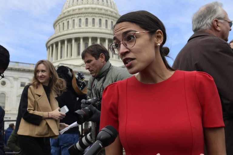 In this Nov. 14, 2018 photo, Rep.-elect Alexandria Ocasio-Cortez, D-N.Y., talks with reporters following a photo opportunity on Capitol Hill in Washington.  While tea party Republicans swept to power to stop things -- repeal Obamacare, roll back environmental regulations and decrease the size and scope of government -- Democrats are marching into the majority to build things back up. And after spending eight downcast years in the minority, they can’t wait to get started. (AP Photo/Susan Walsh)