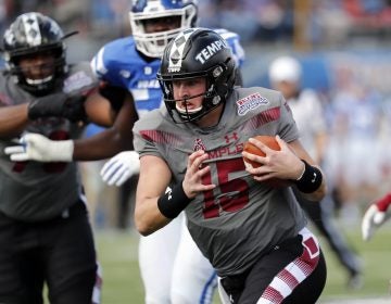 Temple quarterback Anthony Russo (15) runs for a short gain against Duke during the first half of the Independence Bowl, an NCAA college football game, in Shreveport, Louisiana, Thursday. (AP Photo/Rogelio V. Solis)