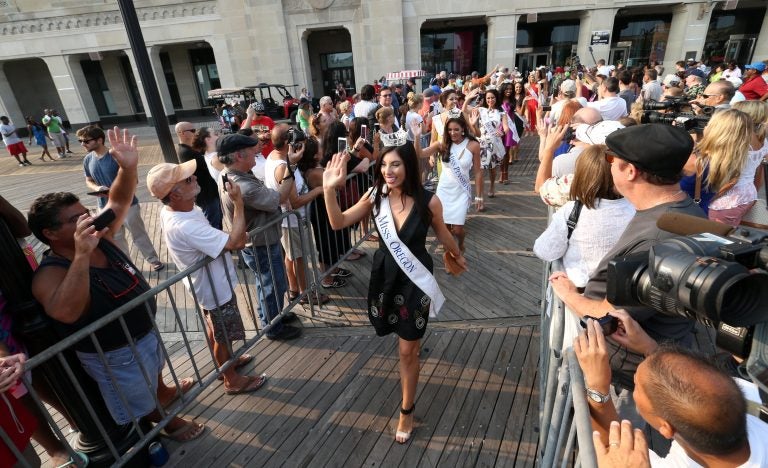 Miss America contestants wave during the traditional Miss America welcoming ceremony on the Atlantic City, N.J., Boardwalk on Tuesday, Sept. 1, 2015.  (Edward Lea/The Press of Atlantic City via AP) 