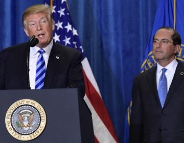 President Donald Trump, stands with Health and Human Services Secretary Alex Azar, and talks about drug prices during a visit to the Department of Health and Human Services in Washington, Thursday, Oct. 25, 2018. (Susan Walsh/AP Photo)