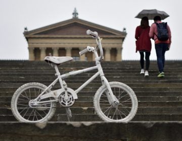 File photo: A white-painted ghost bike is parked on the Philadelphia Art Museum steps, ahead of the Ride of Silence on Wednesday, May 16, 2018. (Bastiaan Slabbers for WHYY)