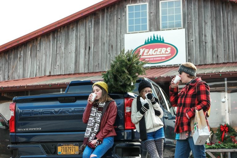 The author's family enjoying the perks of cutting down their own Christmas tree. (Photo Courtesy/Jeff Bogle)