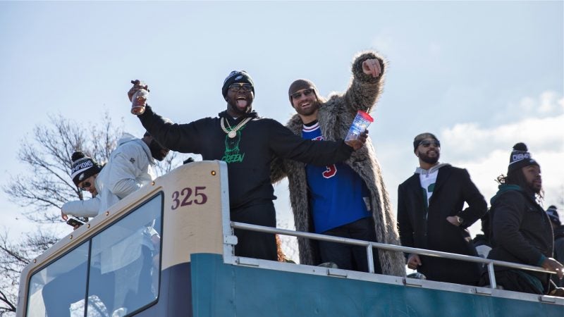 Philadelphia Eagles players celebrate on Broad Street during the Super Bowl Championship parade on Feb. 8, 2018. (Lindsay Lazarski/WHYY)