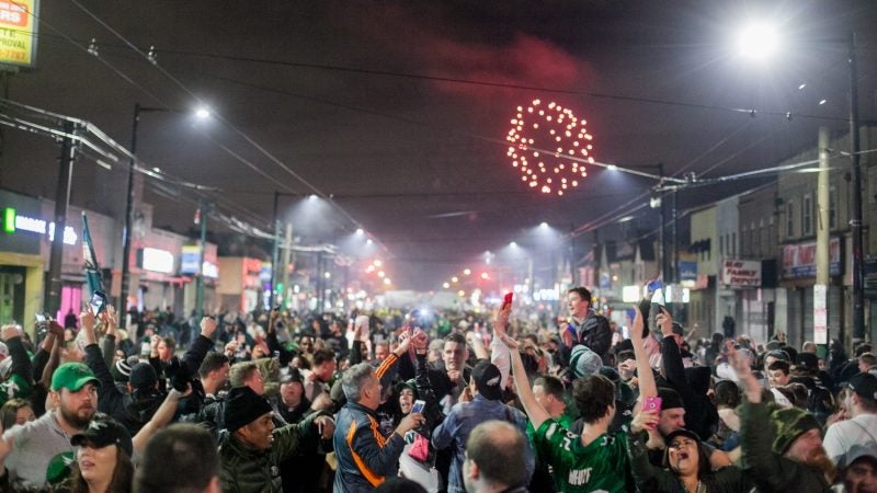 Fans in Northeast Philadelphia flood Frankford and Cottman avenues on Feb. 4, 2018, after the Eagles 41-33 win over the New England Patriots to become the 2018 Super Bowl Champions. (Brad Larrison for WHYY)