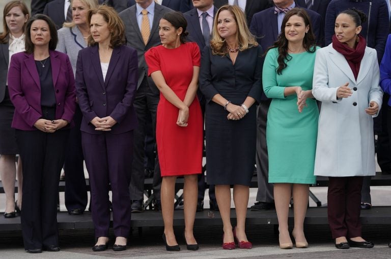 From l-r., Rep.-elect Angie Craig, D-Minn., Rep.-elect Kim Schrier, D-WA., Rep.-elect Alexandria Ocasio-Cortez, D-NY., Rep.-elect Debbie Mucarsel-Powell, D-Fla., Rep.-elect Abby Finkenauer, D-Iowa, and Rep.-elect Sharice Davids, D-KS., line up as they join other members of the freshman class of Congress for a group photo on Capitol Hill in Washington, Wednesday, Nov. 14, 2018. (AP Photo/Pablo Martinez Monsivais)