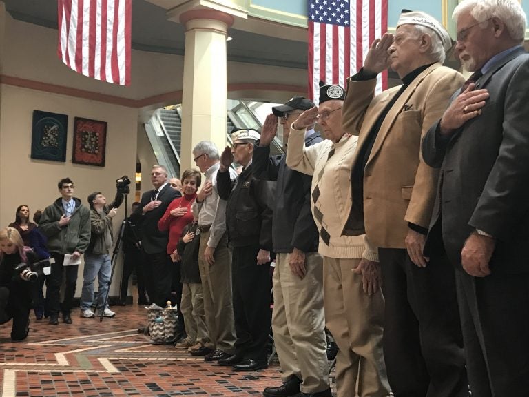 (From left) Hank Heim, William Bonelli, Richard Schimmel and Isaac George salute at a ceremony commemorating the Pearl Harbor attack. (Katie Meyer/WITF)