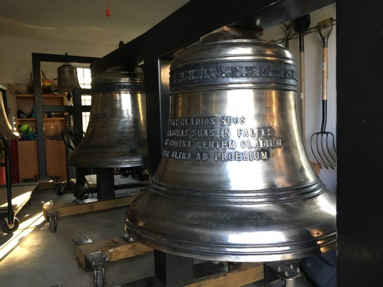 This 1,200 lb. bell, just slightly smaller than the Liberty Bell, sits inside Delaware Symphony Orchestra music director David Amado's garage in Greenville, Delaware. (Mark Eichmann/WHYY)