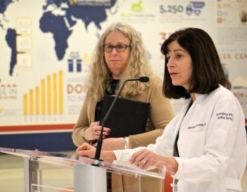 Emergency Dr. Jeanmarie Perrone (right) joins Pennsylvania Secretary of Health Dr. Rachel Levine to announce new prescription guidelines for emergency room doctors dealing with opioids and opioid addiction. (Emma Lee/WHYY)