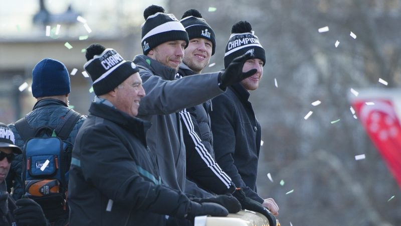 Nick Foles waves to fans at Logan Circle during the Super Bowl parade in Philadelphia on Feb. 8, 2018. (Jonathan Wilson for WHYY)