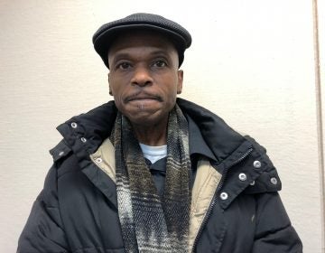 Robert Still, a former inmate living in Camden, owes about $2,000 in municipal court fines he says he is unable to afford. (Joe Hernandez/WHYY)