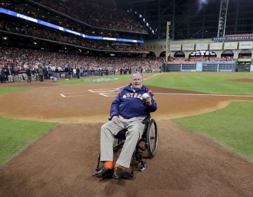 Former President George H.W. Bush waits on the field for first pitch ceremony before Game 5 of baseball's World Series against the Los Angeles Dodgers Sunday, Oct. 29, 2017, in Houston.