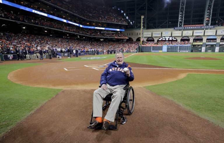 Former President George H.W. Bush waits on the field for first pitch ceremony before Game 5 of baseball's World Series against the Los Angeles Dodgers Sunday, Oct. 29, 2017, in Houston.