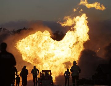 A massive fire roars through a neighborhood in San Bruno, Calif., after a PG&E gas pipeline ruptured, killing eight people, in 2010. (Paul Sakuma/AP)