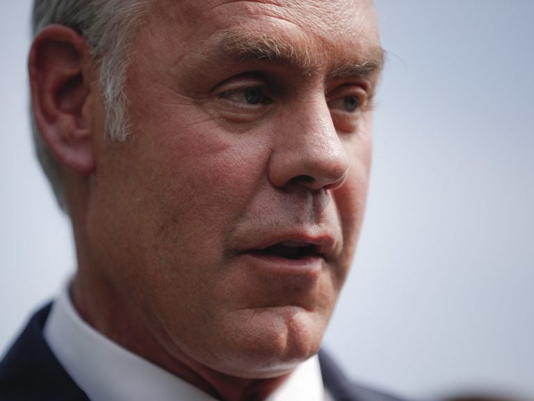 Interior Secretary Ryan Zinke speaks to members of the media outside the White House in August. (Pablo Martinez Monsivais/AP)