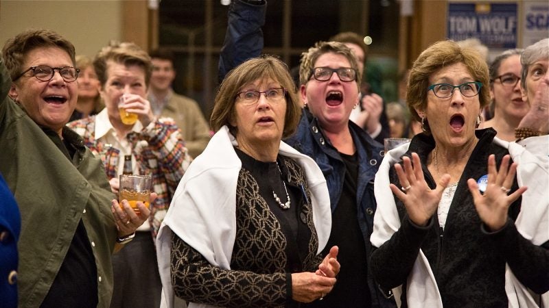 Frankie Franceschini, Linda McCarthy, Bonnie Shuman, and Sandy McCarthy (left to right) react as results come in for the 2018 midterm elections Nov. 6, 2018, in Swarthmore, Pennsylvania. (Emily Cohen for WHYY)