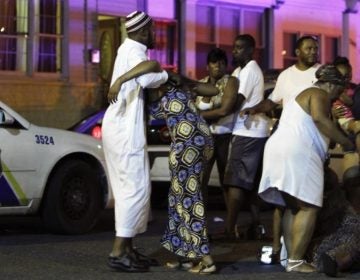 Family members react at the scene of the fatal 2013 collision that took the life of Samara Banks and her three children.  (JOSEPH KACZMAREK/AP)