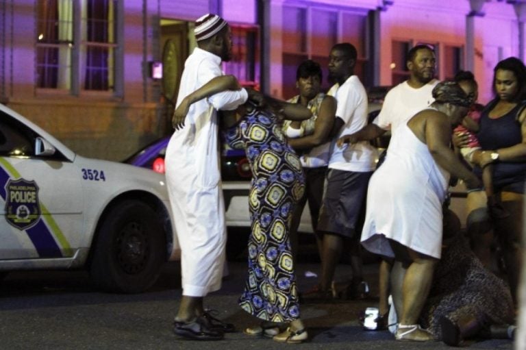 Family members react at the scene of the fatal 2013 collision that took the life of Samara Banks and her three children.  (JOSEPH KACZMAREK/AP)