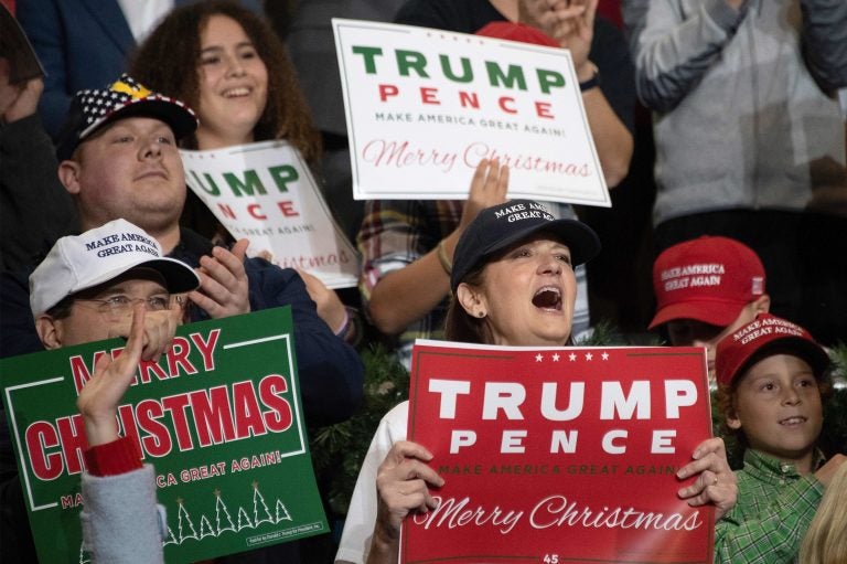 Supporters cheer as President Trump speaks during a rally in Mississippi in November.
(Jim Watson/AFP/Getty Images)