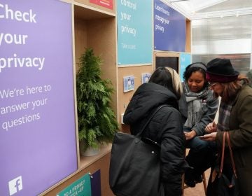 Facebook employees talk to visitors at a one-day Facebook pop-up kiosk in Bryant Park in New York City on Thursday. The company was fielding questions about its data-sharing practices and teaching users how to understand its new privacy controls. The next day, Facebook announced that a 