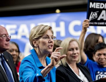 Sen. Elizabeth Warren, a Democrat from Massachusetts (center), was just one of several potential 2020 presidential candidates who came out in support of Sanders' Medicare for All proposal in 2017. (Andrew Harrer/Bloomberg via Getty Images)