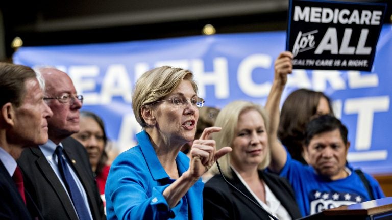 Sen. Elizabeth Warren, a Democrat from Massachusetts (center), was just one of several potential 2020 presidential candidates who came out in support of Sanders' Medicare for All proposal in 2017. (Andrew Harrer/Bloomberg via Getty Images)