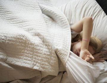 Teens' biological clock drives them to stay up late and sleep in. Most school start times don't accommodate that drive. (Jasper Cole/Getty Images)