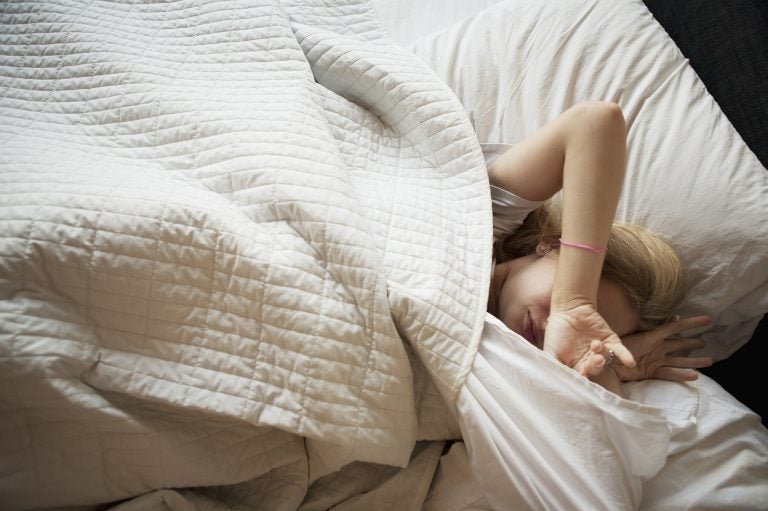 Teens' biological clock drives them to stay up late and sleep in. Most school start times don't accommodate that drive. (Jasper Cole/Getty Images)