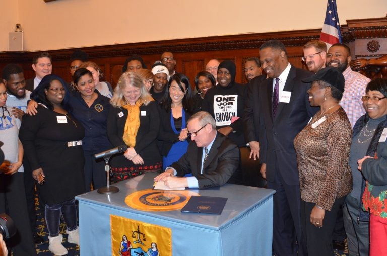 Mayor Kenney signs bills at City Hall (Tom MacDonald/WHYY)