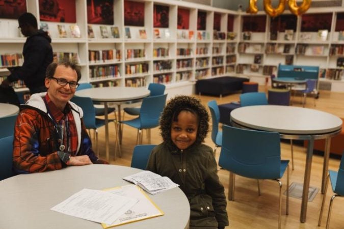 Librarian Rich Torrance likes to play soft music in the library, using it as a conversation starter and a way to set the tone. (Neal Santos for PlanPhilly)