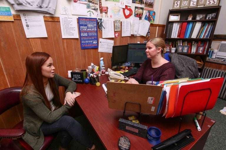 Kim Cooney, director of student success at Chestnut Hill College, meets with senior Erin Crowley. After changing her major, she took extra classes so she could graduate on time. Chestnut Hill started a program this year to get more students to choose a major by sophomore year. (Saquan Stimpson for The Hechinger Report)  