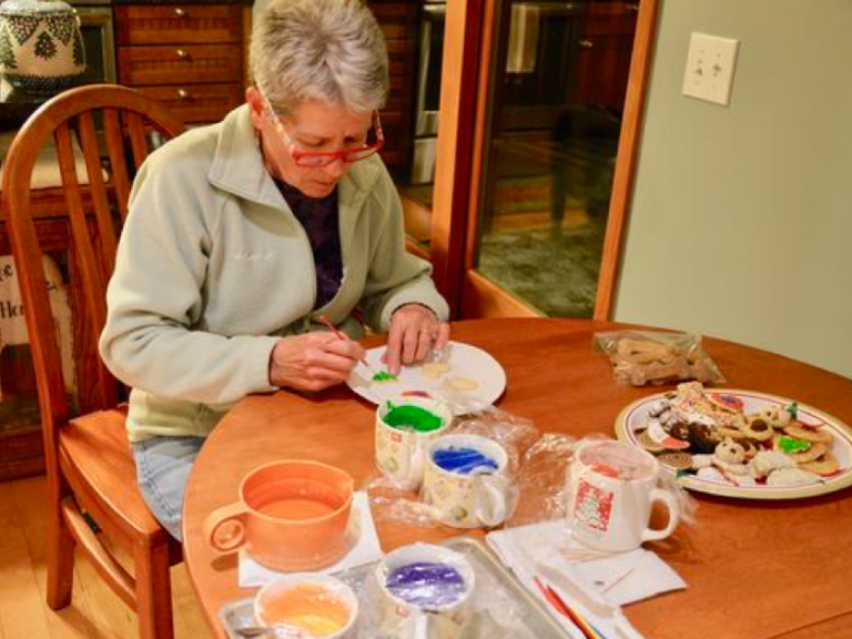 Mary Thode, of Chittenden, Vt., hand decorates hundreds of cookies every year for Christmas. (Nina Keck/Vermont Public Radio)