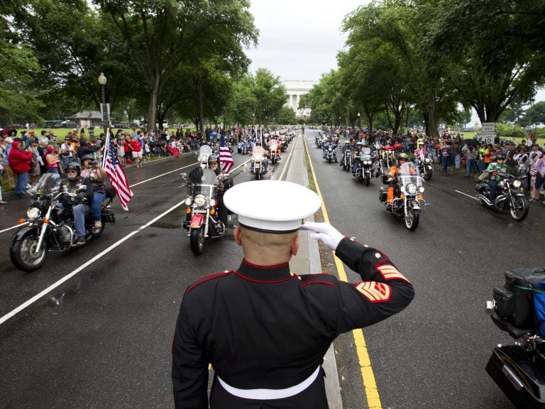 A U.S. Marine salutes as participants in the Rolling Thunder motorcycle rally rumble through Washington, D.C., in 2017. Organizers say the 2019 event will be the last in D.C. (AFP/Getty Images)