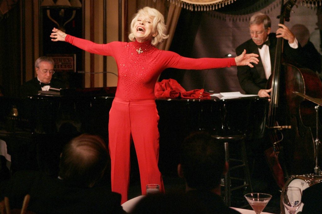 Broadway legend Carol Channing gives a performance of her one-woman show,"The First 80 Years are the Hardest," at the cabaret  Feinstein's at the Regency in New York, Tuesday, Oct. 18, 2005. Channing, 84, was backed up by a trio, including pianist Ken Ascher, left, and Dick Sarpola, right, on bass.