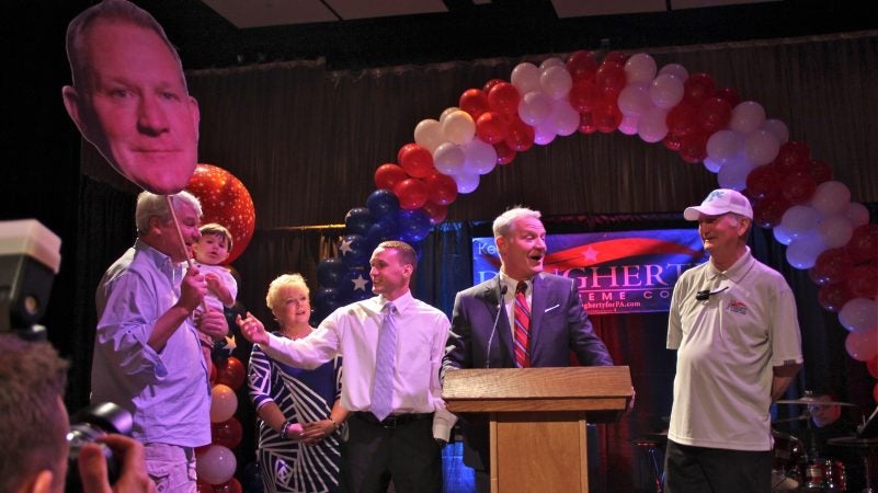 Union leader John Dougherty (left) celebrates after his brother, Kevin Dougherty, won a Democratic nomination for a seat on the Pennsylvania Supreme Court on May 19, 2015. (Emma Lee/WHYY)