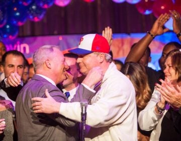 Pennsylvania Supreme Court Judge Elect Kevin Dougherty (left) hugs his brother John Dougherty at a post-election party at the Stagehands Union Hall in South Philadelphia. (Brad Larrison for WHYY)