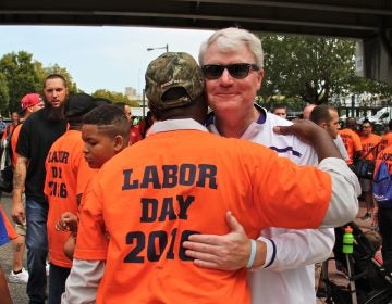 Labor leader John Dougherty embraces a union member during the Labor Day parade in Philadelphia on Sept. 5, 2016. (Emma Lee/WHYY)