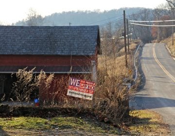 A sign on Riegelsville Road in Holland Township, New Jersey, shows local opposition to the PennEast pipeline. (Emma Lee/WHYY)