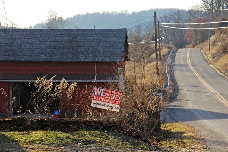 A sign on Riegelsville Road in Holland Township, New Jersey, shows local opposition to the PennEast pipeline. (Emma Lee/WHYY)