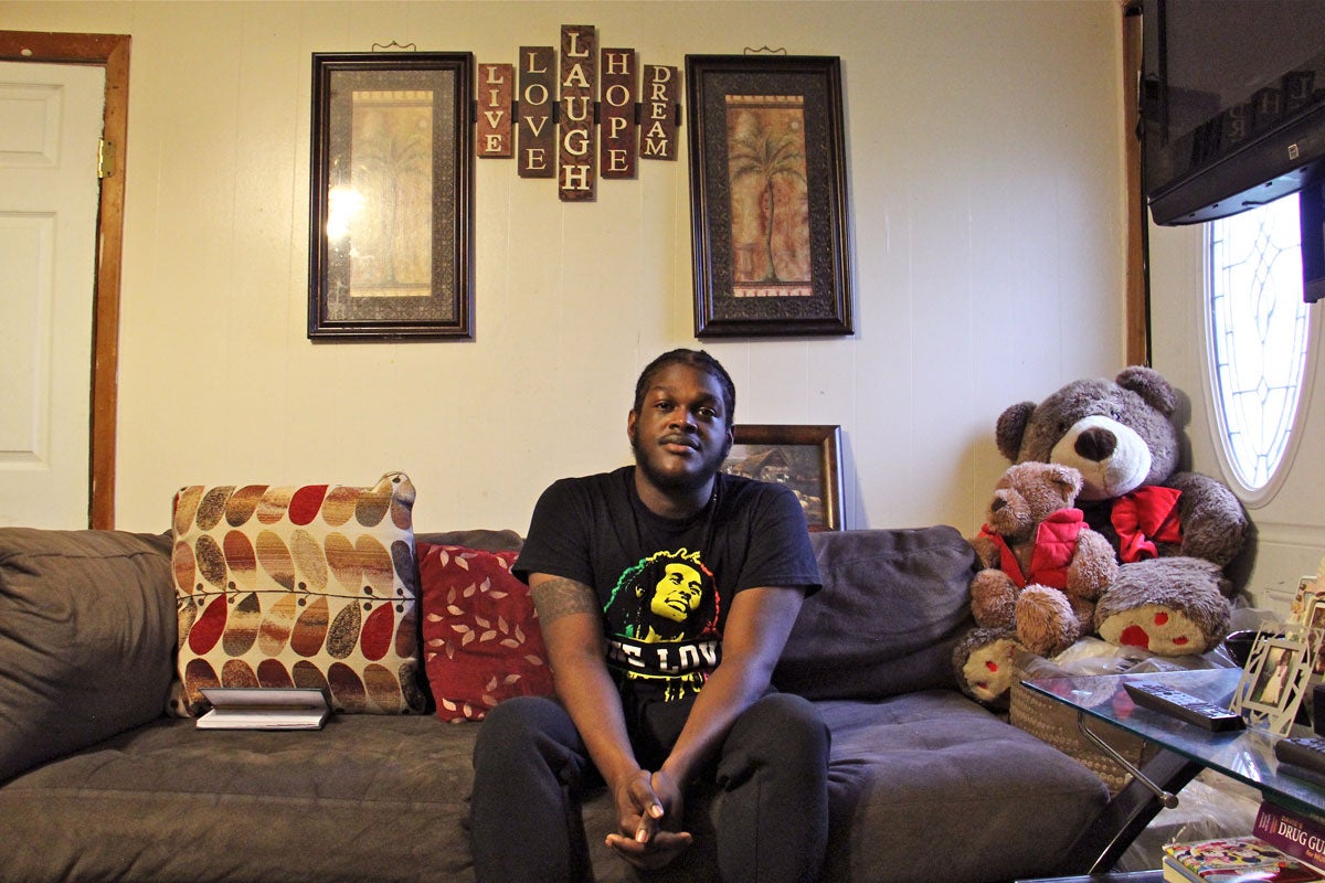 Clive Thompson Jr., 21, of Cedarville, N.J., planned to continue college this year. But since his parents, natives of Jamaica, got a deportation order, he's been busy looking after their house and helping to pay their mortgage while they take sanctuary in a Philadelphia church. (Emma Lee/WHYY)