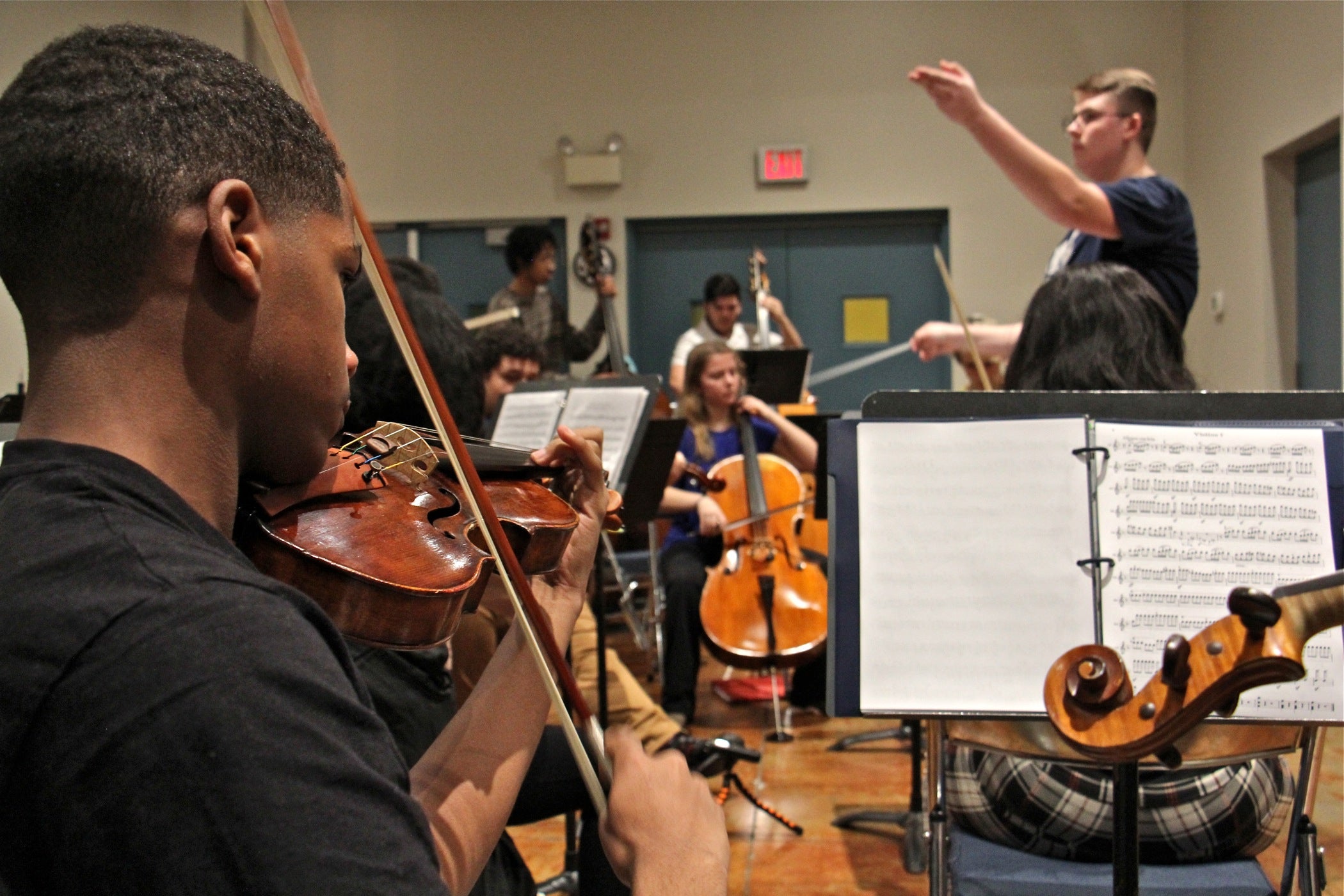 Oleksandr Kashlyuk (right), a founding member of the Center City Chamber Orchestra, conducts during a rehearsal at Settlement Music School. 