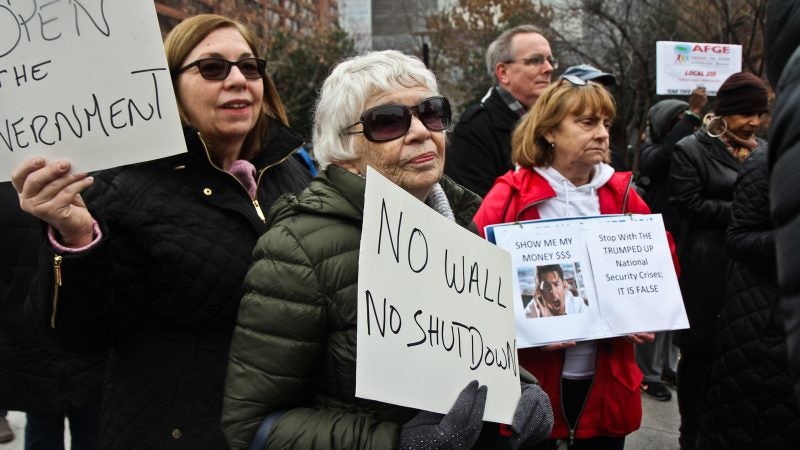 Federal government employees rally to call for an end to the shutdown on Independence Mall Tuesday. (Kimberly Paynter/WHYY)