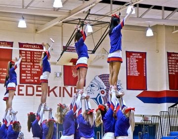 Cheerleaders perform at a Neshaminy Redskins basketball game on Jan. 15, 2019. (Kimberly Paynter/WHYY)