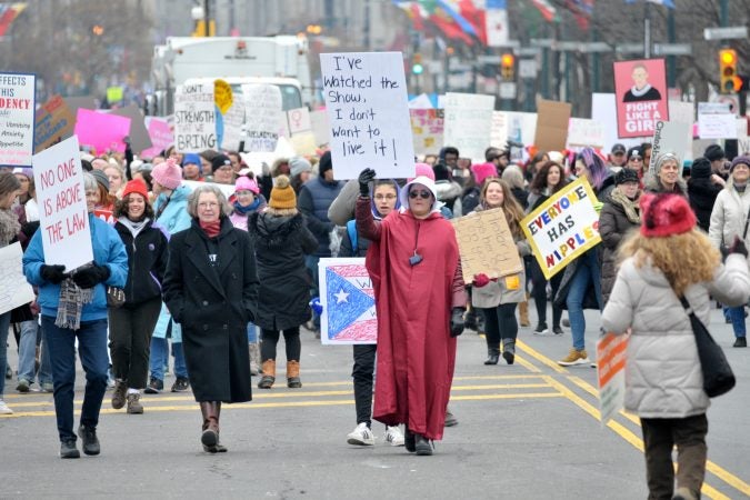 Venus Caceras dons a Handmaid's Tale costume as she participates in the 2019 Women's March along the Benjamin Franklin Parkway in Philadelphia, Pa. (Bastiaan Slabbers for WHYY)