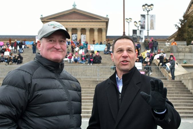 Philadelphia Mayor Jim Kenney and Pennsylvania Attorney General Josh Shapiro look over the crowed gathered in front of the stage at the Art Museum steps during the 2019 Women's March. (Bastiaan Slabbers for WHYY)