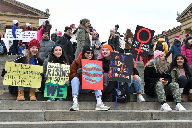 With a lower turnout than previous years, supporters participate in the 2019 Women's March on the Benjamin Franklin Parkway, in Philadelphia, Pa. (Bastiaan Slabbers for WHYY)