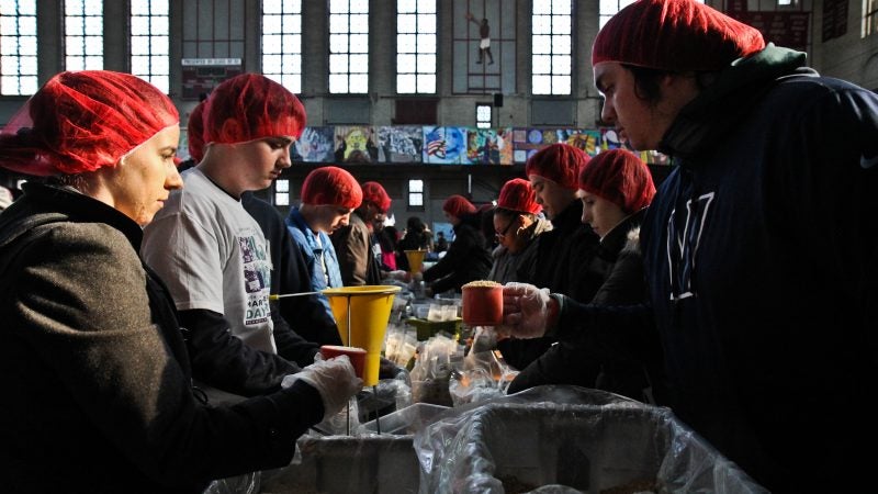 Rise Against Hunger packages dried meals at the MLK Day of Service at Girard College. (Kimberly Paynter/WHYY)