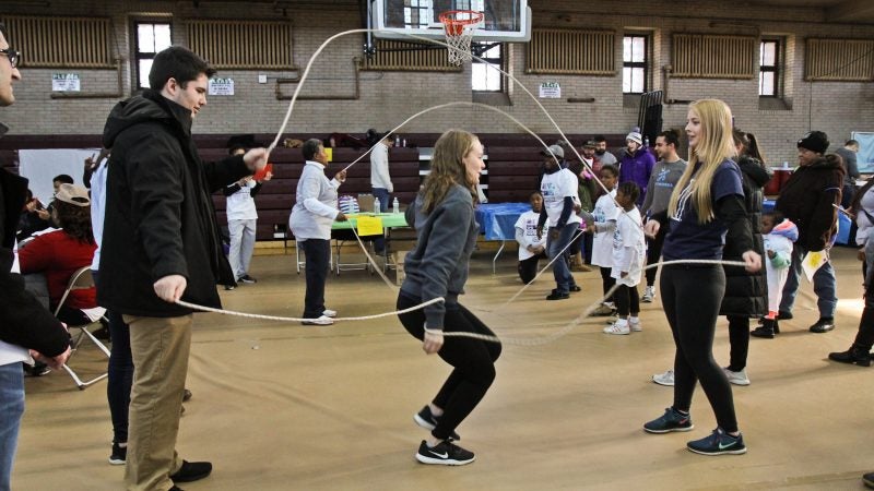 Kids take a break from service projects at the MLK Day of Service at Girard College. (Kimberly Paynter/WHYY)