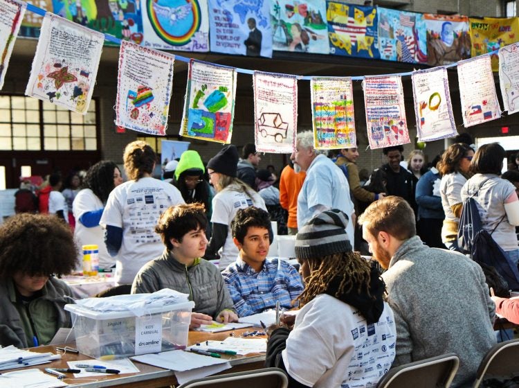 Participants at the MLK Day of Service at Girard College create banners.